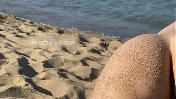 PUBLIC BEACH - Everyone watches how she spread her legs in public. Flashing with her pussy outside.