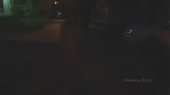 Naked woman walking on the city street in the early morning. Public.