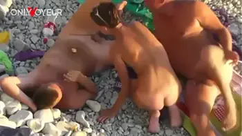 Beach Voyeur. Nude beach swingers foursome with wife exchange