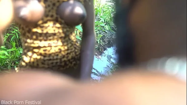 2 African tribe girl having fun with the village chief in the middle of the forrest