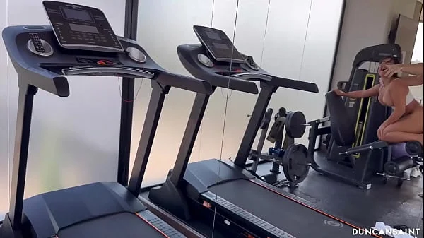 Gorgeous babe does the splits on his cock and squirts all over the gym