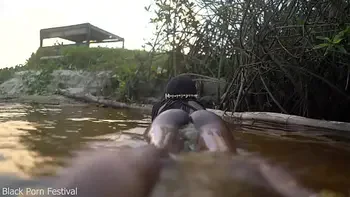 Skinny dark skinned African hottie teasing in the water