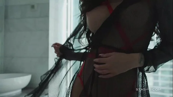 Busty russian babe Megan teasing from the bathtub