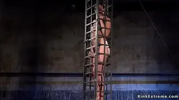 Babe in cage gets water bondage