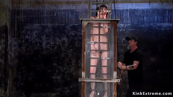 Babe in cage gets water bondage