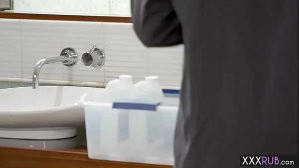 Two petite professionals massage a big cock client