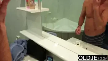 Amazing young busty hottie student gives old man blowjob in bathroom and takes a nice facial cumshot