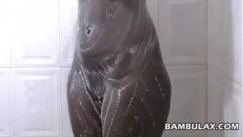 Natural ebony boops taking shower