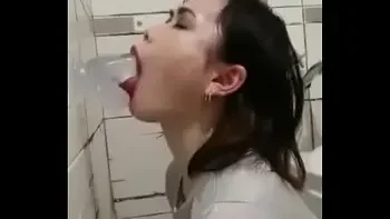 Asian deepthroating a dildo