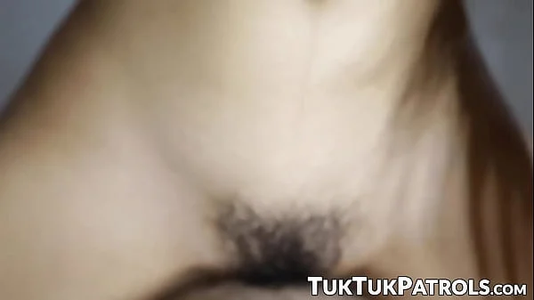 Petite inked Thai teen with hairy pussy rides dick in POV