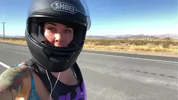 felicity feline riding on aprilia tuono motorcycle