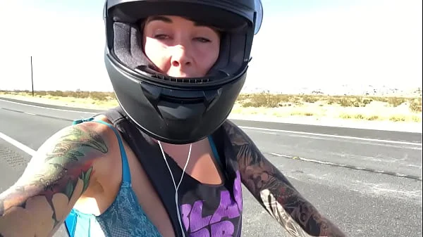 felicity feline riding on aprilia tuono motorcycle