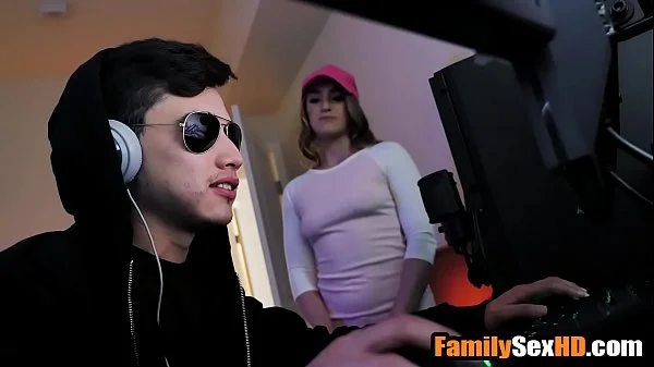 Stepsister fucks stepbrother while he is playing video games