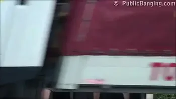 A big natural breasted brunette in public street bus stop threesome orgy gang bang with 2 hung guys with big dicks fucking her with a blowjob and vaginal pussy sex action in front of all the car, bus, and truck drivers and people walking on the street