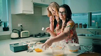 Blonde Charlie Forde and Brunette Chasey Devil Lesbian Cake Baking Sex with Big Natural Tits and Glasses