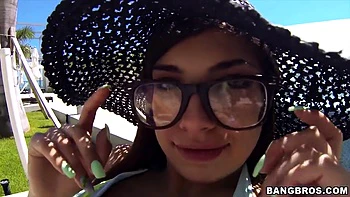 Cute girl in glasses by the pool picked up