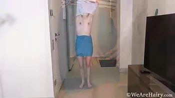 Emaza strips naked after finishing her chores - WeAreHairy