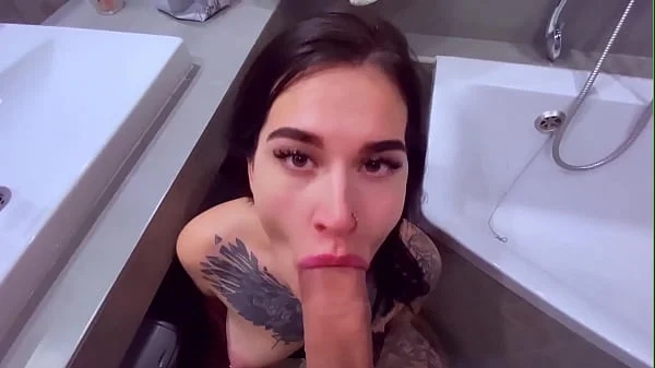 Tattooslutwife sucks a big cock in the bathroom. Gets a load in big mouth