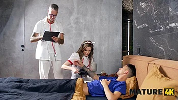 MATURE4K. Sexy Czech nurse is having sex with her patient right in front of the doctor: Porn