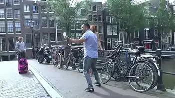 Pretty redhead walking naked in Amsterdam