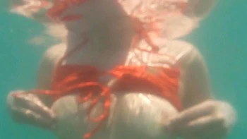 Lovita Fate, sexy angel in bikini by the pool