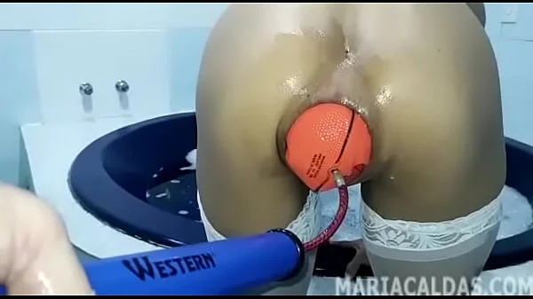 Maria Caldas inserting a giant inflatable basketball ball