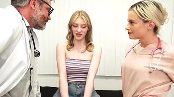 Two cute girls are having fun with a guy in an office setting