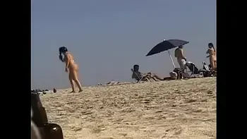 Exhibitionist Wife 19 - Anjelica teasing random voyeurs at a public beach by flashing her shaved cunt!