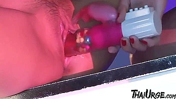 Two Lesbians From Asia Trying Out Their New Dildo