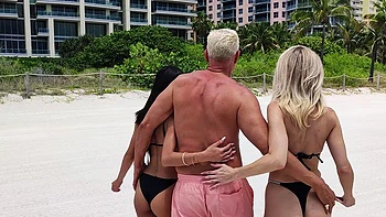 Four sexy babes and their trainer get fucked on the beach in a steamy foursome.