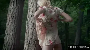 Skinny girl fucks herself hard in the forest