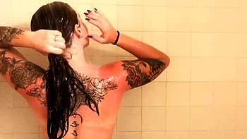 Busty babe playing with her big boobs